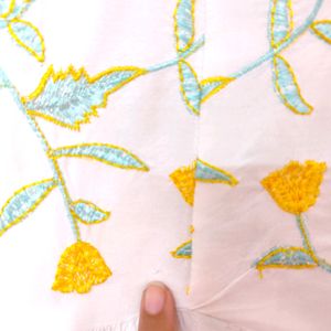 White Top With Yellow And Light Blue Embroidery