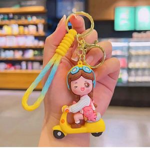 YELLOW SCOOTY GIRL KEYCHAIN