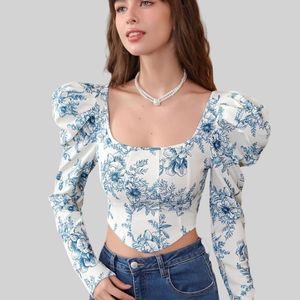 Floral Print: This long sleeve blouse features a v