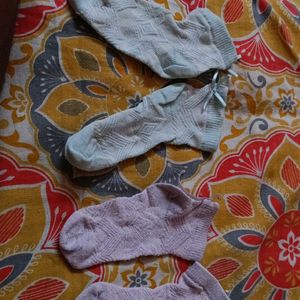 Two Pairs Of Baby Socks. Pink And Green