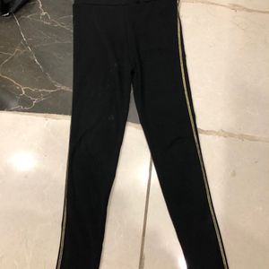 Black Leggings With Golden Striped Sides