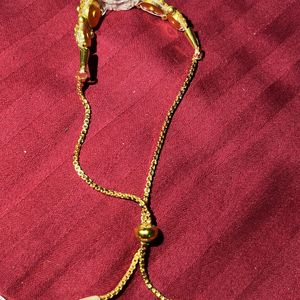 Designer Golden Rakhi/Bracelet