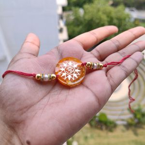 Orange Om Resin Rakhi