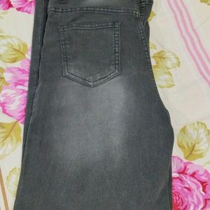 Black Jeans With Faded Pattern On Front