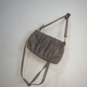 Beige Cremish Sling Bag.