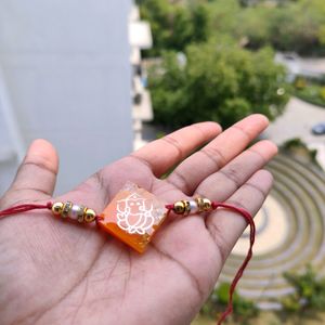 Orange Ganeshji Resin Rakhi