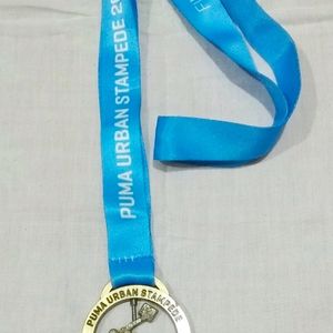 Collectible PUMA Urban Stampede Finisher Medal.