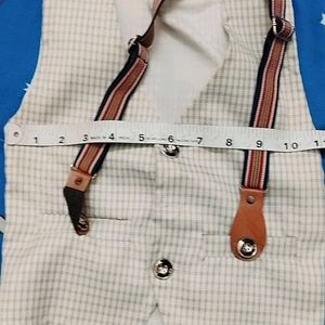 A Chek Jacket With Striped Suspenders