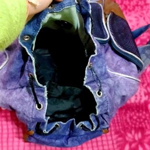 IT IS A PURPLE COLOR SHOULDER BAG.....