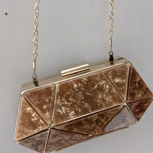 Golden brown diamond shape clucth