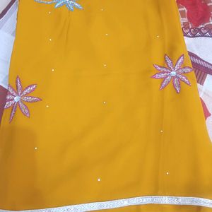 A Gold Yellow Saree With Beautiful Print