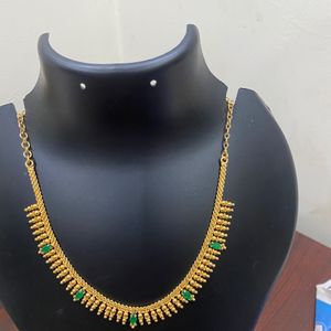 One Gram Gold Plated Jwellary Necklace.Green Stone Work .colour Guarantee .Hand Made Jwellary.Very Reasonable Price.18 Inches