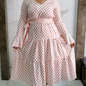 Three tiered orange polka print white dress