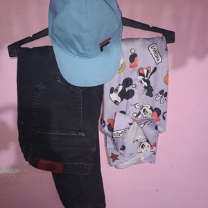 Cap With Printed Shirt And Faded Jeans