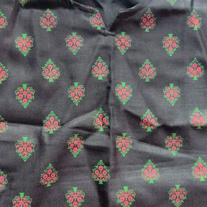 pure cotton black colour long kurta which has red and green printed flowers ..the kurta is unused