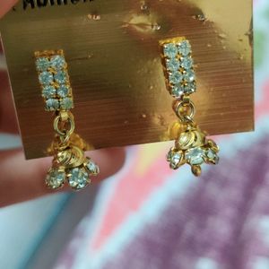 Golden Jhumki Earrings With Silver Stones