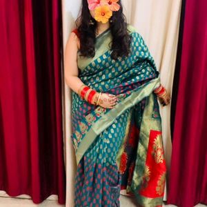 Dark green silk saree with stiched blouse