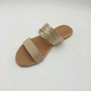 Tan And Gold Flat Sandals.