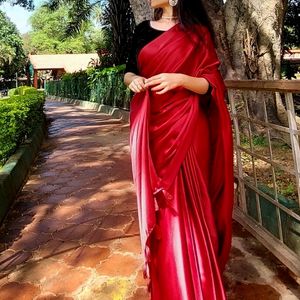 HOT RED SATIN SAREE WITH BLACK VELVET BLOUSE .