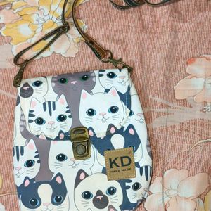 Kitty print sling bag