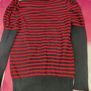 A Red And Black Stretchable Top Of Size L Which ca