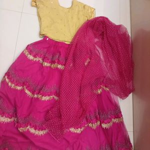 golden choli and dark pink ghaghra with duppatta