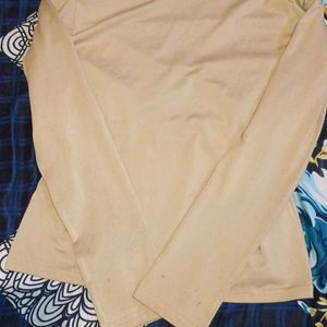 A Tan Colour t-Shirt With Designer Neck.