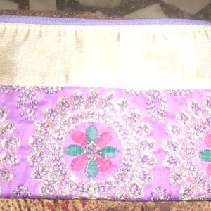 A Violet Colour Pouch With Embroidery