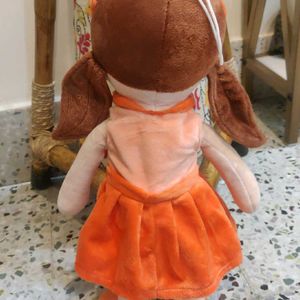 A Cute Baby Girl On Orange Frock