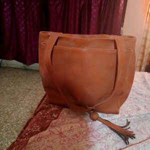 Tan Handbag with 2 big and 2 side pockets and 1 internal pocket