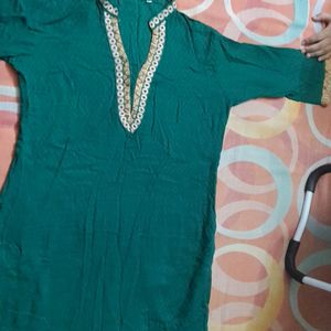 Dark green cotton kurta ...three quarters sleeves...beautiful neck line...no flaws..