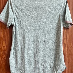 Grey Top With Small Mauve Pocket On The Left Side