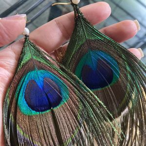 Wiknd Pricedrp: Brand NewPeacock Feather earrings