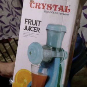 Manual Fruit Juicer With A Glass Tubler