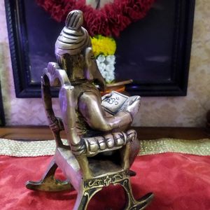 Ganesh Sitting On A Rocking Chair Idol