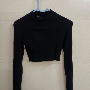 Cropped ribbed turtleneck top