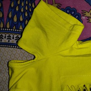 A Yellow Color Shoulder Cut Top.