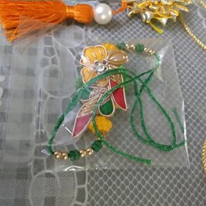 Saffron White Green Coloured Rakhi for Bhai Bhabhi