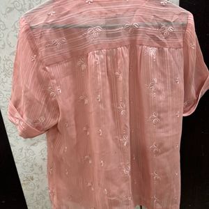 A Pretty Peach Top With Delicate Embroidered Motif