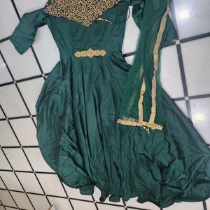 Luxurious Silk Dark Green Gown With Golden Stone