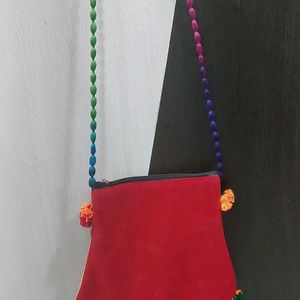 red sling bag