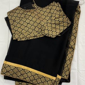 Pretty Black Saree With Golden Border..