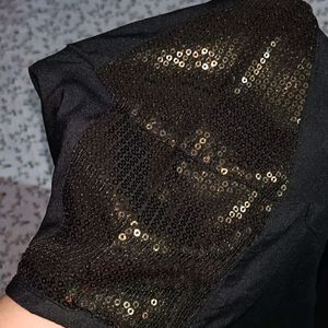 Gothic black top with sequined shoulders