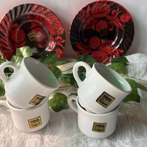 4 White Cups And 2 Plastic Red Colour Plates