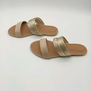 Tan And Gold Flat Sandals.