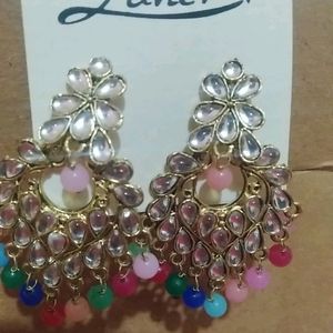 Beautiful ear rings multi colored with stones and gold polish