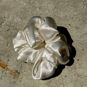 Shiny White Scrunchy Or Rubber Band.