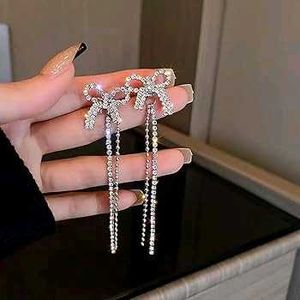 Studded Bow Dangling earrings