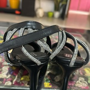 Love in black shimmer strap heels