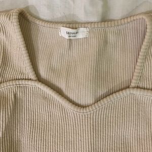 beige top